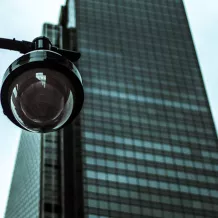 Security camera in front of a skyscraper