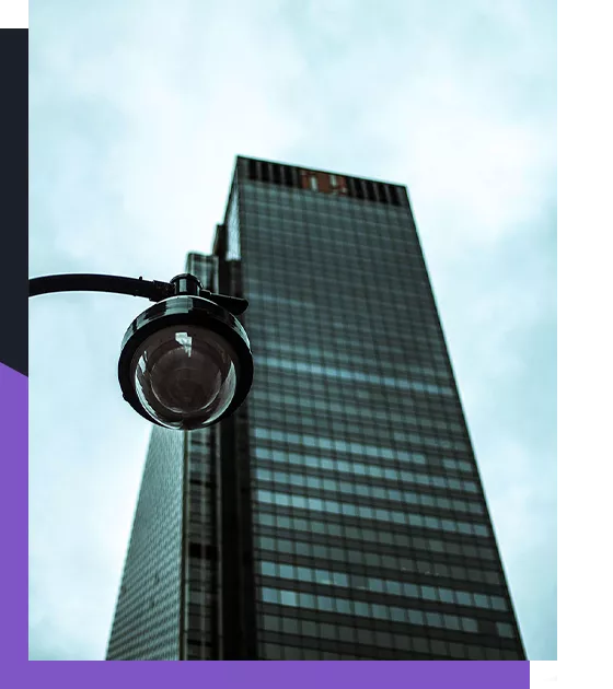 Security camera in front of a skyscraper
