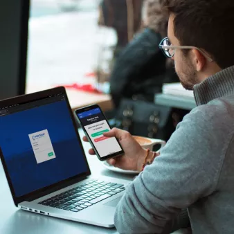 Young male coworker using MFA